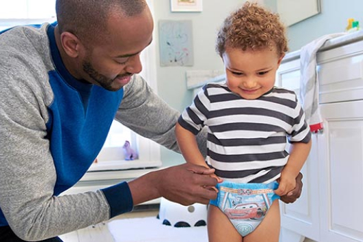 A father teaching their baby wear Pull-ups Training pants